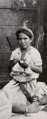 Young girl embroidering, Ramallah, 1900