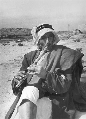 Palestinian man playing flute